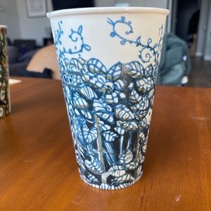 ~2010 Anthropologie painted ceramic cup - blue leaves